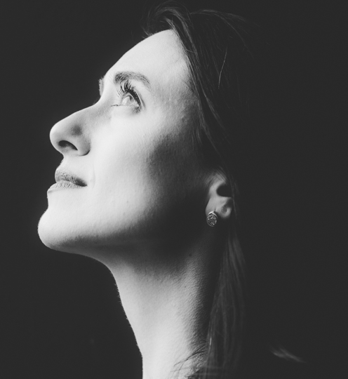profile of woman looking up black and white