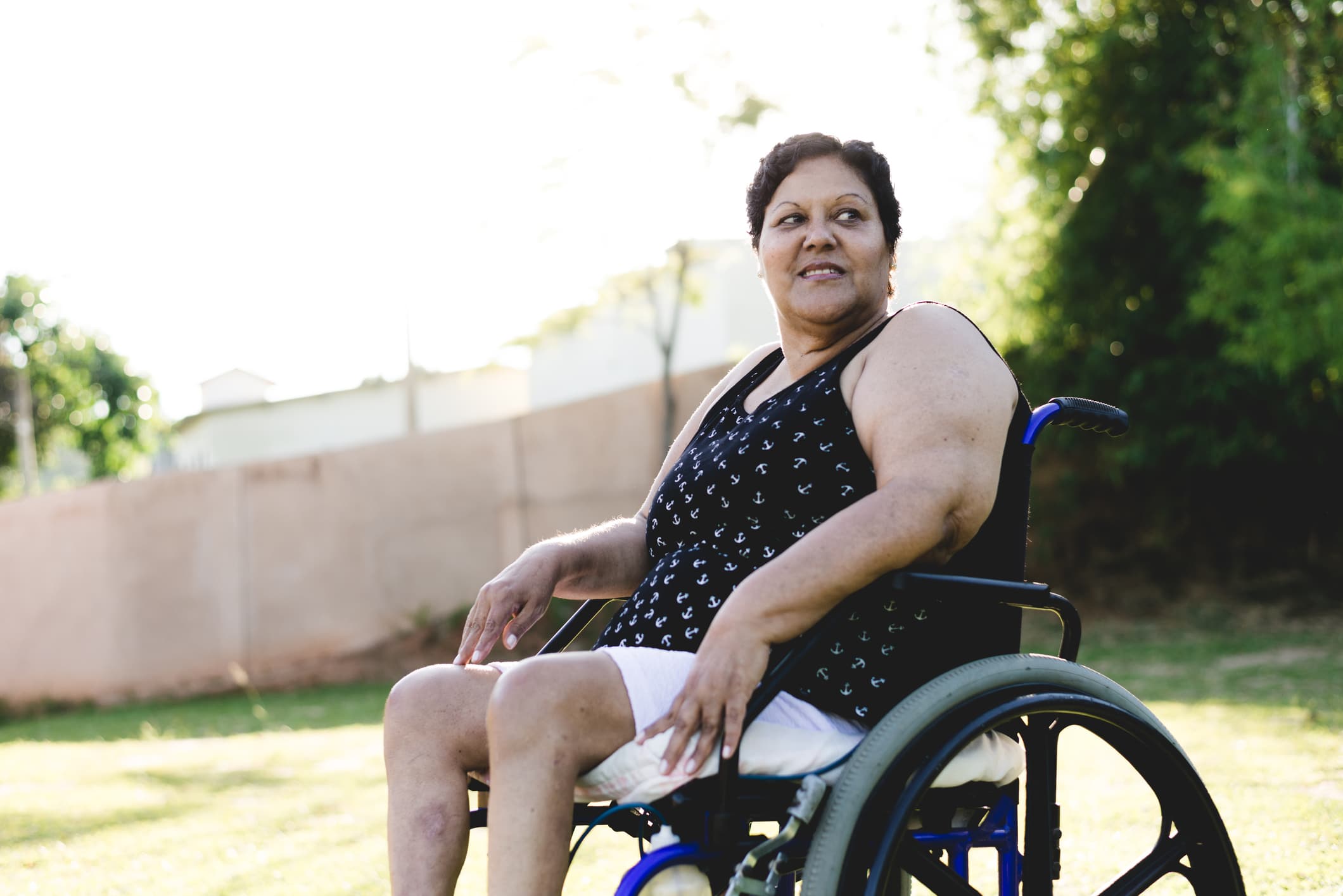 woman with short brown hair in wheelchair